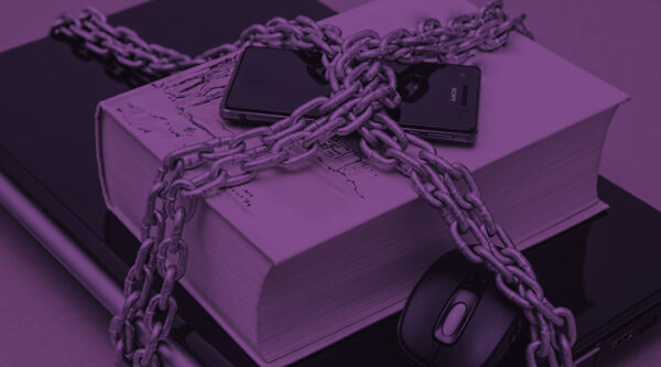 chain around phone book and laptop